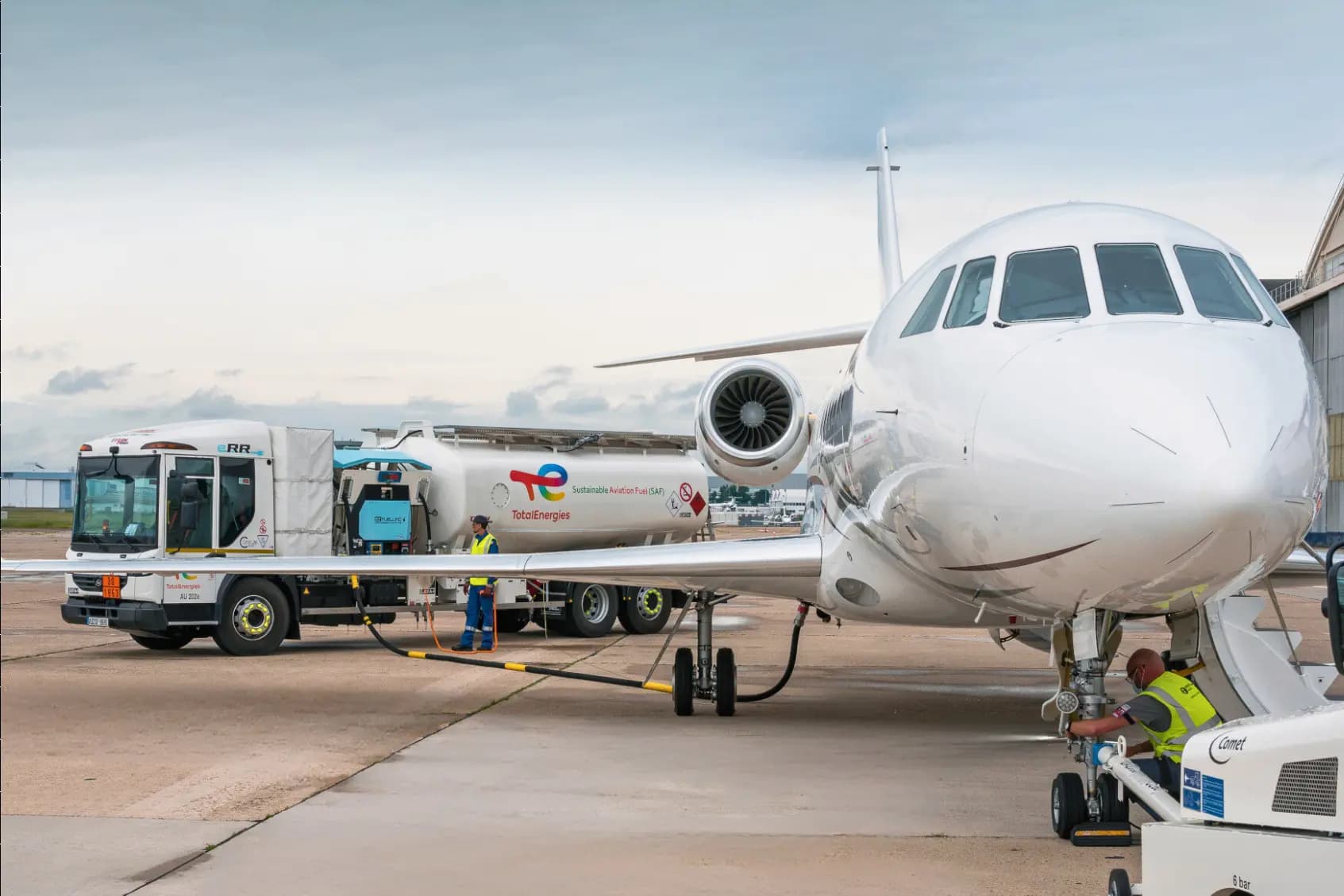 A truck refueling a jet